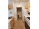 Functional kitchen space offering essential appliances and access to laundry facilities at 5345 E Van Buren St # 116, Phoenix, AZ 85008