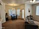 Inviting living room featuring dining area, neutral tones, and comfortable seating arrangement at 5345 E Van Buren St # 116, Phoenix, AZ 85008