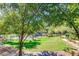 Scenic community pond area featuring lush greenery, a fountain, and relaxing surroundings at 5345 E Van Buren St # 116, Phoenix, AZ 85008
