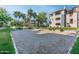 Inviting outdoor area with a sand volleyball court, providing a recreational space for residents at 5345 E Van Buren St # 116, Phoenix, AZ 85008
