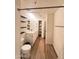 Bright bathroom with a double sink vanity, tiled floors, and a mirrored closet at 5345 E Van Buren St # 216, Phoenix, AZ 85008