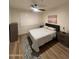 Cozy bedroom with natural light, a ceiling fan, and minimalist decor at 5345 E Van Buren St # 216, Phoenix, AZ 85008