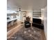 Spacious living room with kitchen and dining area, offering a contemporary open floor plan at 5345 E Van Buren St # 216, Phoenix, AZ 85008