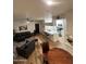 Inviting living room with modern furnishings, an open layout, and light wood-look floors at 5345 E Van Buren St # 216, Phoenix, AZ 85008