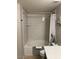 Bathroom with white subway tile surround, modern fixtures, and a shower-tub combination at 5345 E Van Buren St # 370, Phoenix, AZ 85008