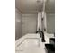 Bathroom with white subway tile surround, modern fixtures, and a shower-tub combination at 5345 E Van Buren St # 370, Phoenix, AZ 85008