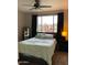 Comfortable bedroom with a large window, plush carpeting, and neutral decor at 5345 E Van Buren St # 370, Phoenix, AZ 85008