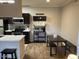 Well-equipped kitchen with stainless steel appliances and dining table at 5345 E Van Buren St # 370, Phoenix, AZ 85008