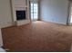 Carpeted living room featuring a fireplace at 7420 W Morrow Dr, Glendale, AZ 85308