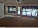 Living room with view to bay window and pool at 7420 W Morrow Dr, Glendale, AZ 85308
