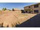 Spacious backyard with gravel landscaping and a patch of dirt for a potential garden or lawn at 8022 S 48Th Dr Dr, Laveen, AZ 85339