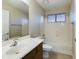Bathroom featuring tile floors, vanity with a large mirror and a shower-tub combo at 8022 S 48Th Dr Dr, Laveen, AZ 85339