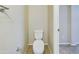 This bathroom features a white toilet, neutral walls and tile floors, perfect for functionality at 8022 S 48Th Dr Dr, Laveen, AZ 85339