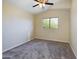 Neutral carpeted bedroom with vaulted ceiling and bright light at 8022 S 48Th Dr Dr, Laveen, AZ 85339