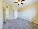 Neutral carpeted bedroom with closet space and bright light at 8022 S 48Th Dr Dr, Laveen, AZ 85339