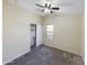 This bedroom features neutral walls, plush carpeting, a window, and a ceiling fan for comfortable living at 8022 S 48Th Dr Dr, Laveen, AZ 85339