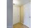 This hallway features tile flooring and access to different rooms via white doors at 8022 S 48Th Dr Dr, Laveen, AZ 85339