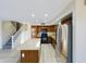 Well-lit kitchen showcasing a center island, black appliances, and wooden cabinets at 8022 S 48Th Dr Dr, Laveen, AZ 85339