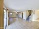 Spacious living room features tile floors, and natural light from large windows and sliding glass doors at 8022 S 48Th Dr Dr, Laveen, AZ 85339