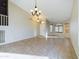 Spacious living room with large windows, tile floors, modern lighting and a white front door at 8022 S 48Th Dr Dr, Laveen, AZ 85339