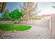 Picture of a backyard with a tree and a block wall at 836 N Sinova Ave, Gilbert, AZ 85234