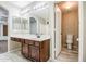 Bathroom featuring a vanity with a large mirror and storage cabinets at 836 N Sinova Ave, Gilbert, AZ 85234