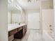 Bathroom vanity with storage cabinets and a separate shower and tub at 836 N Sinova Ave, Gilbert, AZ 85234