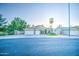Charming single-story home featuring a three car garage and manicured front yard at 836 N Sinova Ave, Gilbert, AZ 85234