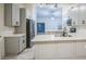 Updated kitchen with stainless steel appliances, and granite countertops, offering a modern aesthetic at 836 N Sinova Ave, Gilbert, AZ 85234