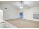 Spacious living room features a ceiling fan and sliding glass doors to the backyard at 836 N Sinova Ave, Gilbert, AZ 85234