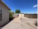 The backyard features a storage shed, concrete, gravel, and a block fence, offering a versatile outdoor space at 8738 W Griswold Rd, Peoria, AZ 85345