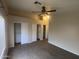 Bedroom featuring a ceiling fan, and ample closet space, making it a comfortable retreat at 8738 W Griswold Rd, Peoria, AZ 85345