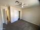 Standard bedroom with closet, neutral color scheme, and ceiling fan at 8738 W Griswold Rd, Peoria, AZ 85345