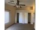Bedroom featuring a ceiling fan, and ample closet space, making it a comfortable retreat at 8738 W Griswold Rd, Peoria, AZ 85345