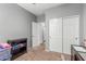Bedroom with carpet, built-in storage and neutral paint at 8828 N 102Nd Ln, Peoria, AZ 85345