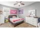 Cozy bedroom with plush carpet, ceiling fan and lots of space for personalization at 8828 N 102Nd Ln, Peoria, AZ 85345