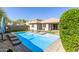 Inviting backyard swimming pool, complemented by artificial turf and modern landscaping at 8828 N 102Nd Ln, Peoria, AZ 85345