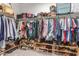 Spacious walk-in closet featuring ample clothing racks, shelving, and storage for shoes and accessories at 8828 N 102Nd Ln, Peoria, AZ 85345