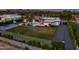 Expansive property featuring a modern home, lush lawn, pool, sport court, and putting green at 9148 N 66Th Pl, Paradise Valley, AZ 85253