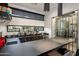 Elegant home bar with dark countertops, under-cabinet lighting, and a wine rack feature for entertaining at 9148 N 66Th Pl, Paradise Valley, AZ 85253