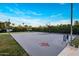 This home features a private basketball court surrounded by mature landscaping and an adjacent putting green at 9148 N 66Th Pl, Paradise Valley, AZ 85253