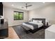 A modern bedroom featuring carpet, minimalist decor, and large bright windows at 9148 N 66Th Pl, Paradise Valley, AZ 85253