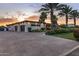 View of the home's exterior showing the garage, driveway, and landscaping at 9148 N 66Th Pl, Paradise Valley, AZ 85253