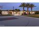 This luxurious home features a sport court, lush landscaping, and palm trees for ultimate privacy at 9148 N 66Th Pl, Paradise Valley, AZ 85253