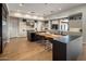Spacious kitchen with a large island, modern appliances, and a seamless connection to outdoor living space at 9148 N 66Th Pl, Paradise Valley, AZ 85253