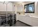 Clean laundry room with modern washer, dryer, and sleek white cabinetry at 9148 N 66Th Pl, Paradise Valley, AZ 85253