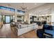 Open concept living space with a large sectional couch, a modern kitchen, and ample natural light at 9148 N 66Th Pl, Paradise Valley, AZ 85253