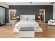An inviting main bedroom suite with hardwood floors, neutral palette, and dual access to ensuite bath and walk-in closet at 9148 N 66Th Pl, Paradise Valley, AZ 85253