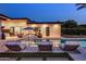 Inviting pool and lounge area features comfortable seating, perfect for enjoying warm evenings and relaxation at 9148 N 66Th Pl, Paradise Valley, AZ 85253