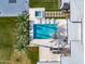 Aerial view of a backyard pool, spa, patio, and tropical landscaping at 9148 N 66Th Pl, Paradise Valley, AZ 85253